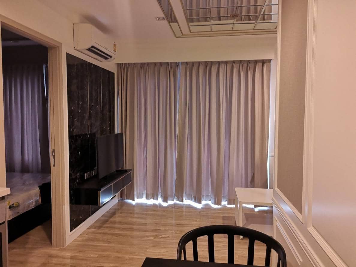 Rhythm Sukhumvit 36-38, living room published on the PropertyScout card
